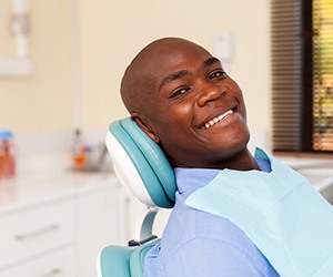 Man smiling after the initial dental implant consultation