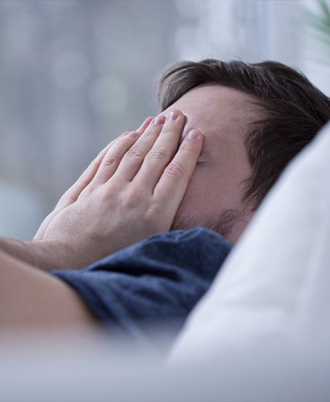 Frustrated man in need of sleep apnea treatment